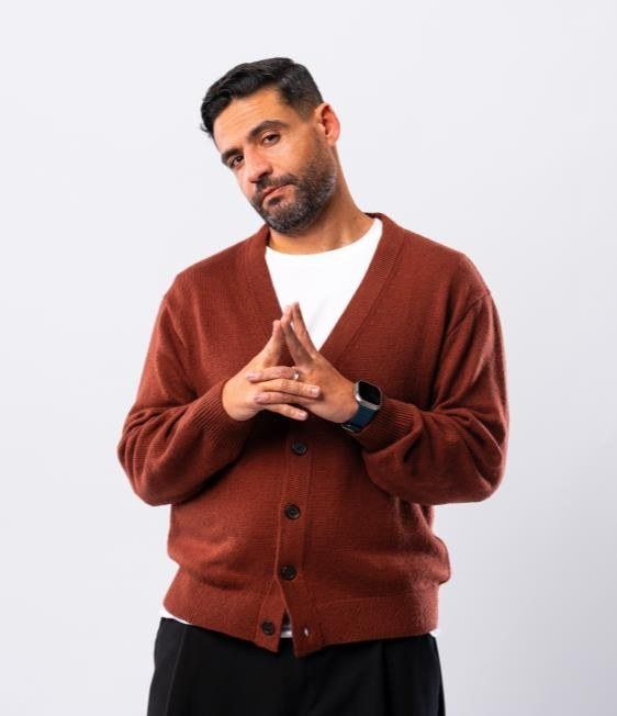 Islam Fawzy with his hands pressed together